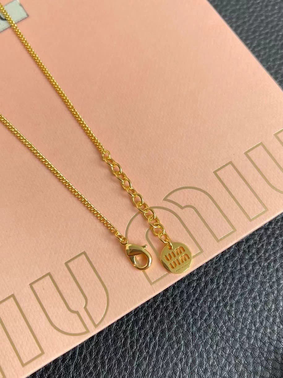 Miu Miu necklace with red circular pendant
